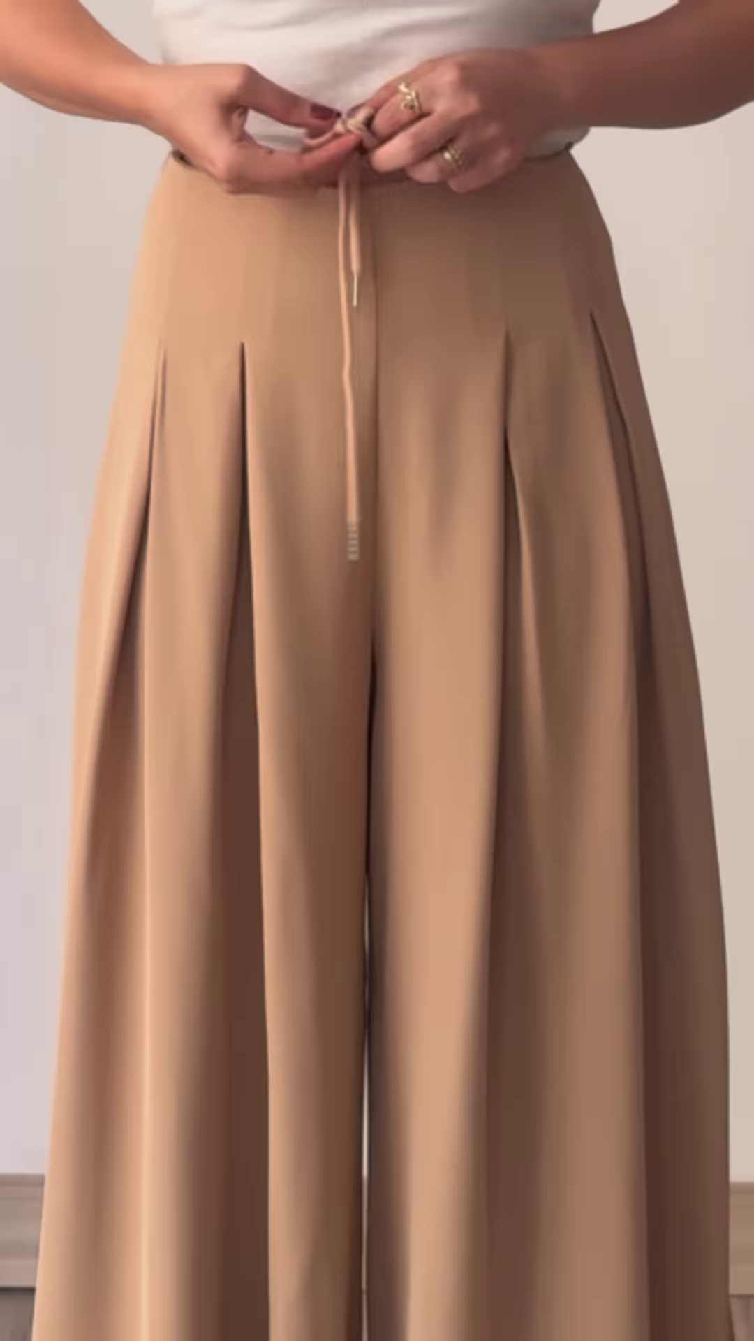 Women’s Beige Wide-Leg Pleated Pants with Drawstring Waist – Flowing Casualwear Styled with White Sneakers - Image 3