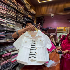 White Buttoned Utility Jacket with Chest Flap Pockets over Striped Inner Layer