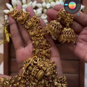 Traditional Gold-Toned Nagas Necklace Set with Intricate Deity and Elephant Carvings