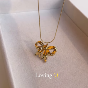 Elegant Gold-Toned Bow Pendant Necklace - Delicate and Charming