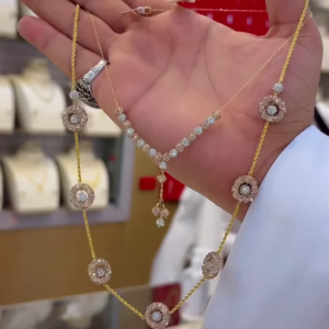 Elegant Two-Tone Gold Necklace with Diamond-Accented Floral Motifs