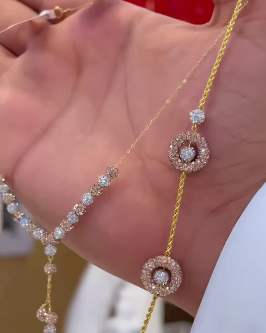 Elegant Two-Tone Gold Necklace with Diamond-Accented Floral Motifs - Image 2