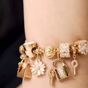 Elegant Gold-Toned Charm Bracelet with Sparkling and Symbolic Charms