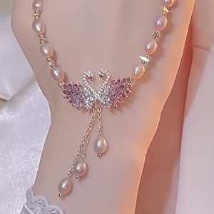 Elegant Pearl Necklace with Sparkling Swan Pendant and Gemstone Accents