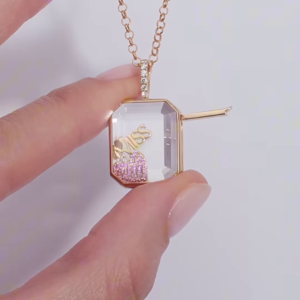 Whimsical Gold-Toned Shaker Necklace with Floating Pink Bag and Gold "BOSS" Charm
