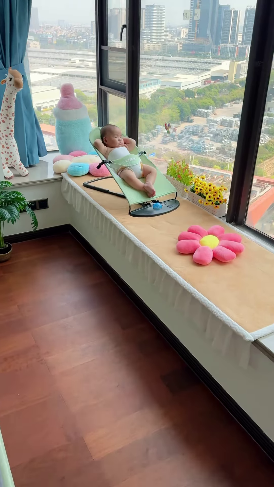 Peaceful Newborn Baby Sleeping Soundly in a Comfortable Bouncer Seat by the Window - Image 2