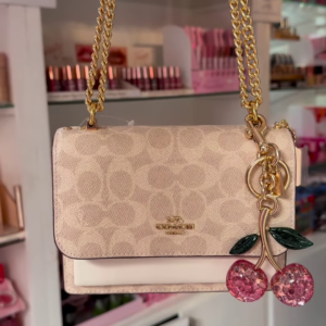 Elegant Designer Crossbody Bag with Signature Pattern and Chain Strap