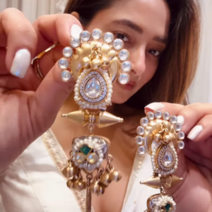 Elegant Gold-Toned Statement Earrings with Intricate Detailing and Chain Drapes