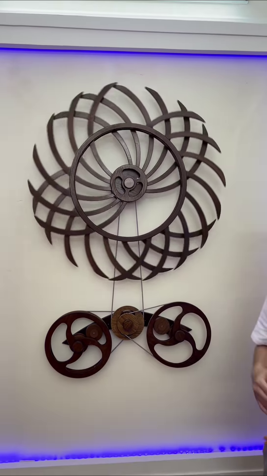 Intricate Kinetic Wall Sculpture with Moving Gears and Abstract Design
