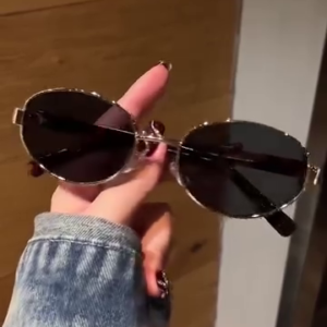 Retro Oval Sunglasses with Slim Metal Frame and Dark Lenses
