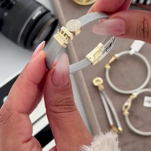 Adjustable Mesh Bracelet with Decorative Clasp and Sparkling Accents