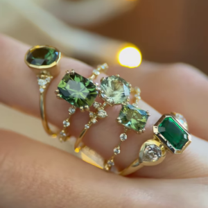 Exquisite Green Gemstone Rings in Gold-Toned Settings with Dazzling Accents