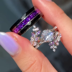 Elegant Two-Tone Couple's Ring Set: Modern Black Band with Purple Sparkle & Silver-Toned Leaf-Inspired Ring with Clear and Lilac Gemstones