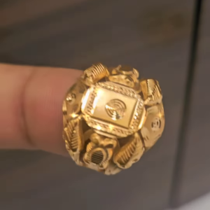 Bold Gold-Toned Ring with Textured and Patterned Design