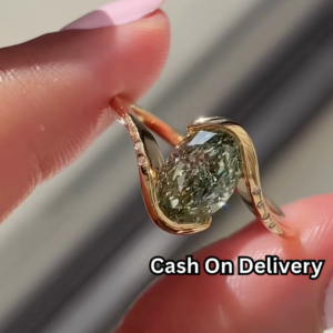 Elegant Gold-Toned Statement Ring with Oval Green Gemstone and Pave Accents