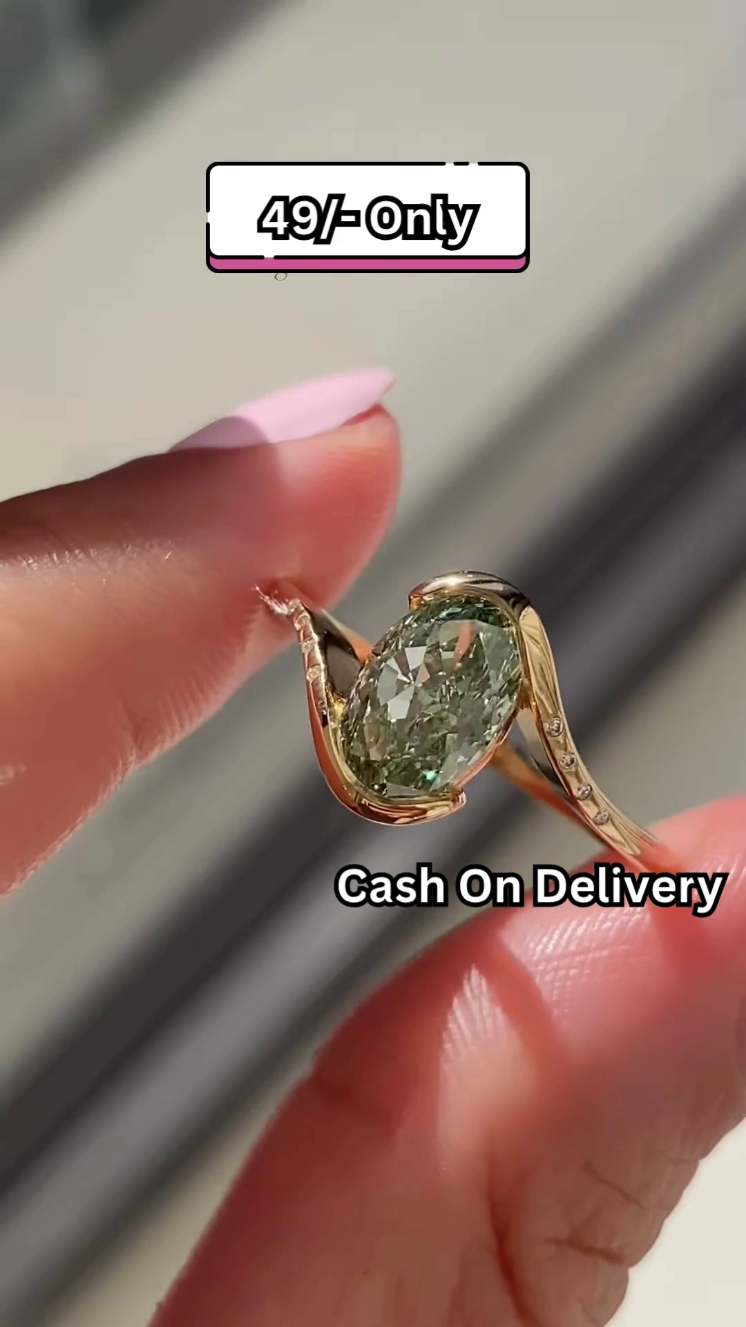 Elegant Gold-Toned Statement Ring with Oval Green Gemstone and Pave Accents - Image 2