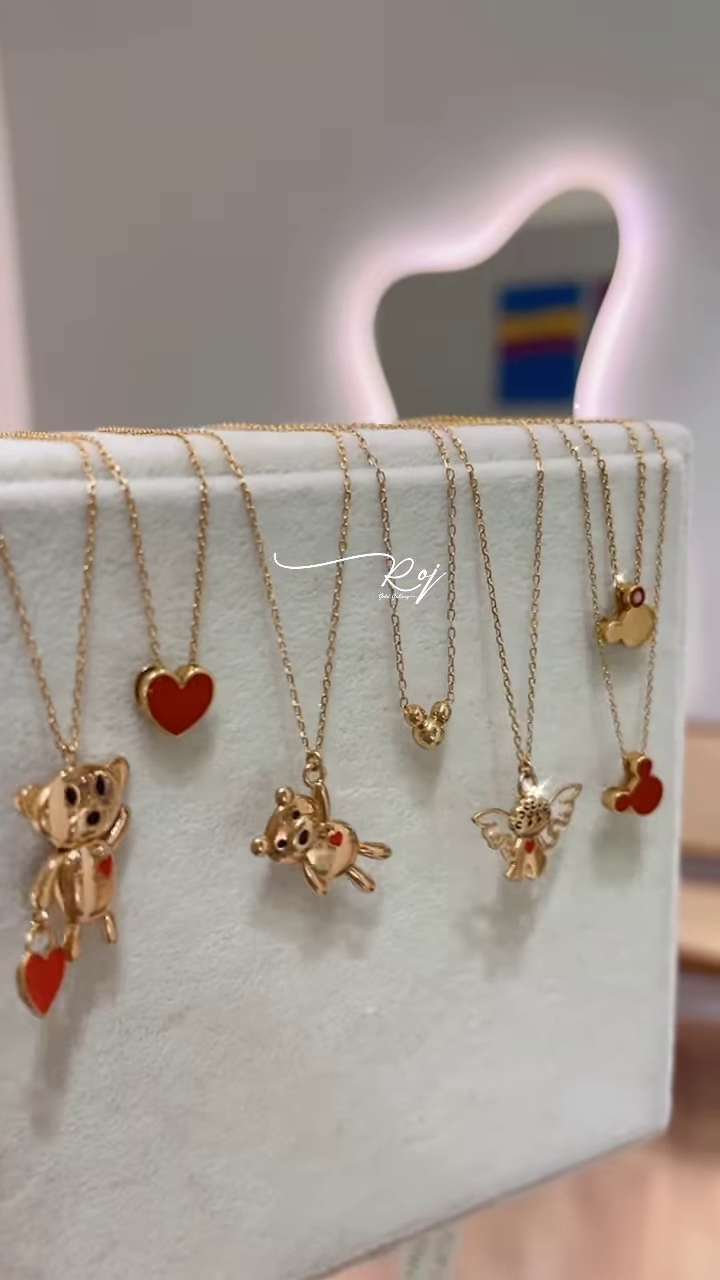 Elegant Gold-Toned Necklaces with Animal Pendants - Image 3