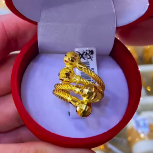 Exquisite Gold-Toned Spiral Ring with Textured Spherical Accents