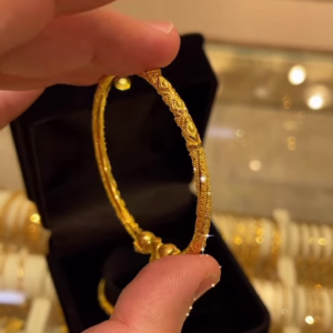 Exquisite Gold-Toned Bangle with Intricate Traditional Filigree and Textured Detailing