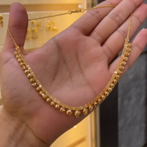 Elegant Gold-Toned Necklace with Spherical Beads and Interwoven Chain Detail