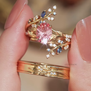 nchanting Gold-Toned Ring with Pink Center Gemstone and Diamond-Accented Vine Band