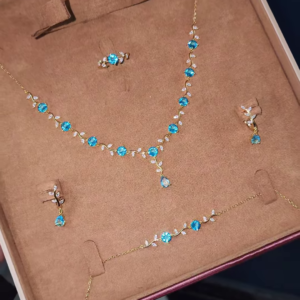 Elegant Gold-Toned Ring with Blue Gemstone Floral Design