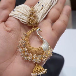 Exquisite Gold-Toned Peacock Pendant with Dazzling Clear Gemstones, Pearl Strands, and Blue Drop