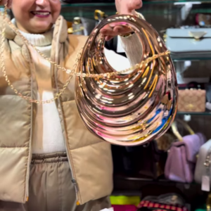 Sculptural Rose Gold-Toned Metallic Clutch with Wavy Design and Chain Strap