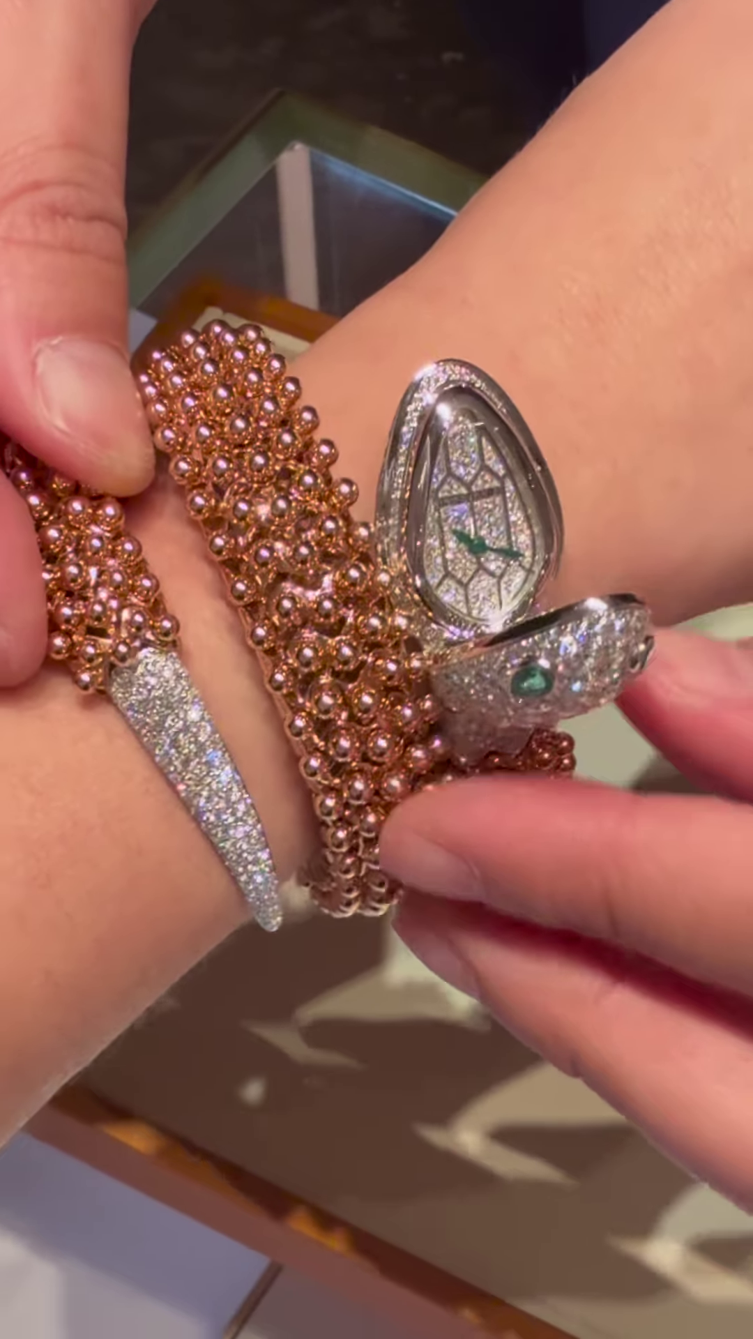 Exotic Rose Gold-Toned Coiled Snake Bracelet with Dazzling Clear Gemstones and Emerald-Inspired Eyes - Image 2