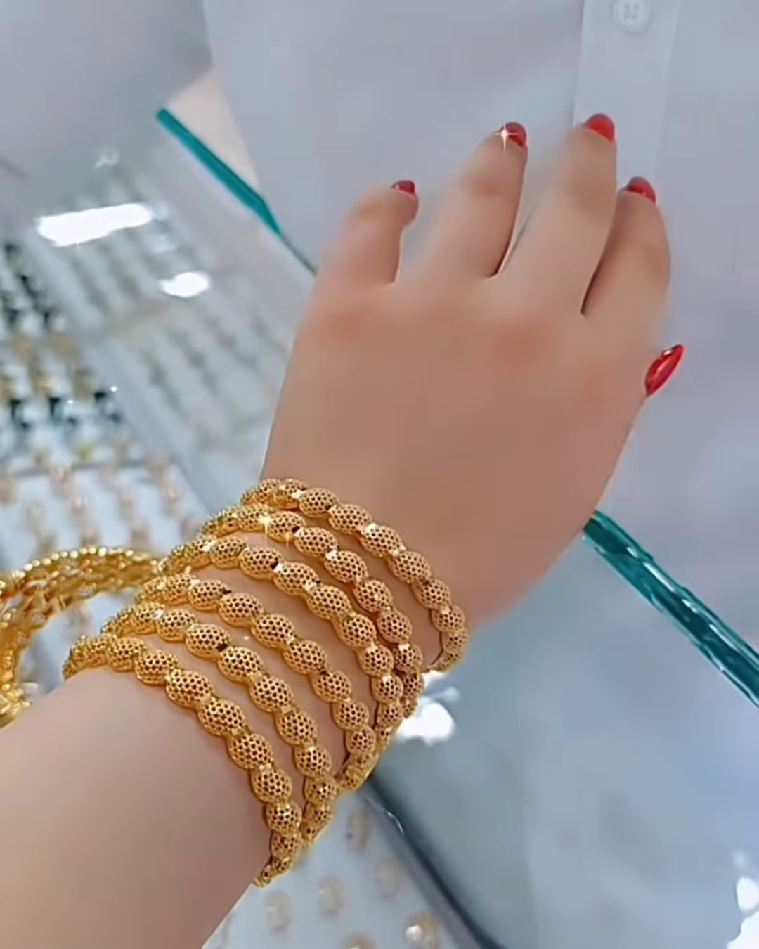 Radiant Gold-Toned Bangle Set with Intricate Spherical Beaded Texture - Image 2