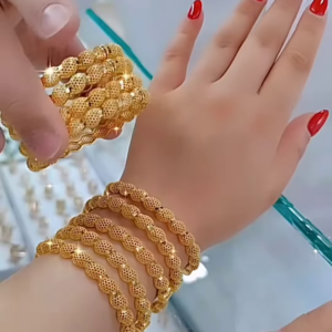 Radiant Gold-Toned Bangle Set with Intricate Spherical Beaded Texture