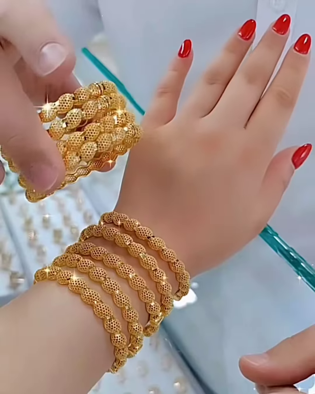 Radiant Gold-Toned Bangle Set with Intricate Spherical Beaded Texture