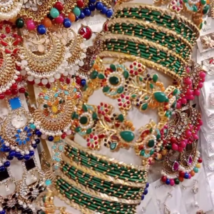 ibrant Green and Gold-Toned Bangle and Earring Set with Intricate Gemstone Embellishments